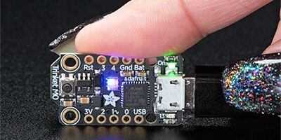 Image of Adafruit’s 3500 Trinket M0 dev board measures only 27 mm x 15.3 mm x 2 mm