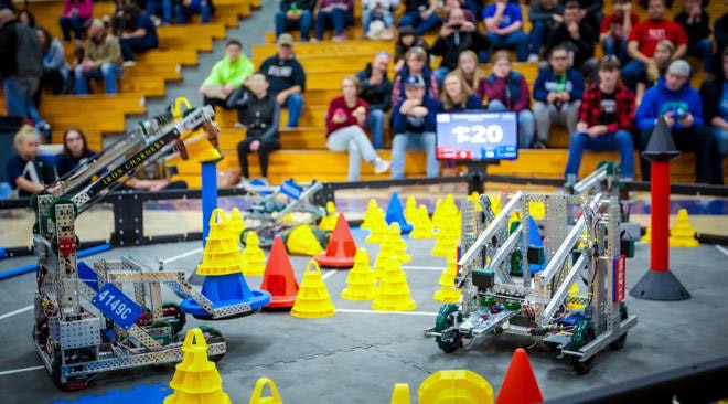 Two teams competing to stack cones to gain points and win the round