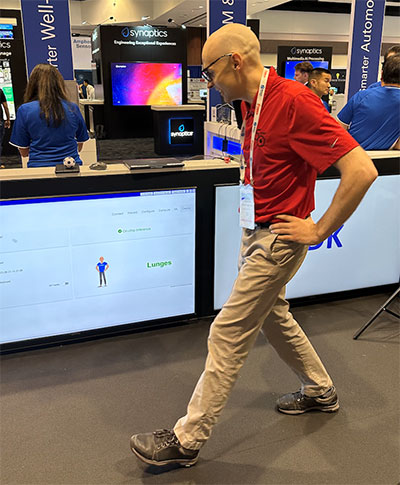 Screen at the TDK booth registering lunges from a health tracker worn on the wrist