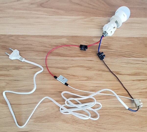 Image of bulb and holder connected to power cord