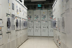 A hallway of power control panels